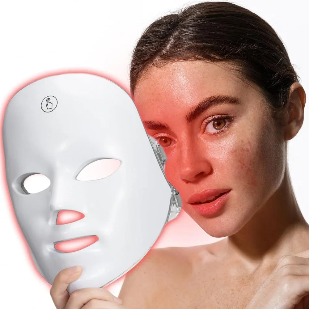 Elegant woman wearing the Prismé LED Mask™, glowing red light showcasing advanced skincare.